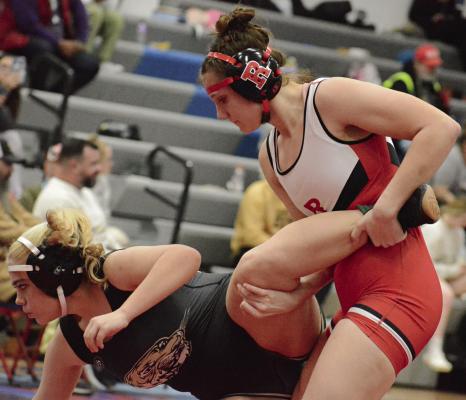 MAKYNLEI CRAIG of Excelsior Springs (left) tries to escape the clutches of Richmond sophomore Taylor Baker at the Drew Emerson Invitational. SHAWN RONEY | Staff