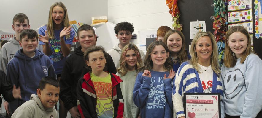 MEREDITH FREECE (with award) celebrates winning the Local Legend Best Teacher award with her class at Hardin Central. SHARON DONAT | Staff