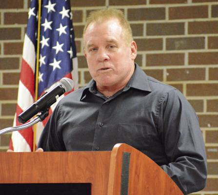 FORMER RICHMOND coach and teacher Ken Simmons introduces his daughter, Ashley (Simmons) Smith, before she gives her Richmond High School Athletic Hall of Fame induction speech June 8 in the high school commons area. SHAWN RONEY | Staff