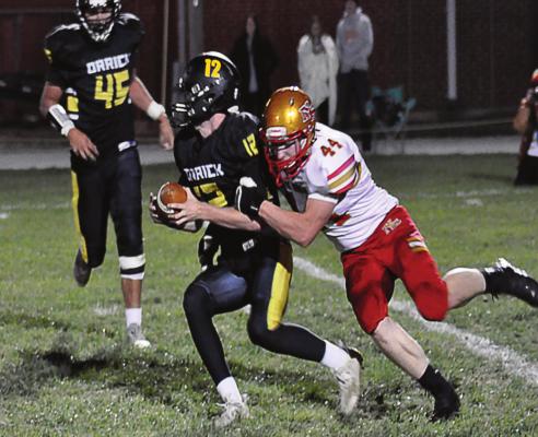 ORRICK QUARTERBACK Blake Buchanan tries to break free from Luke Schwanke’s grasp Oct. 16 at Simmons Field. SHAWN RONEY | Staff