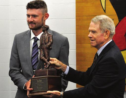 DYLAN COMSTOCK receives the Kenneth Smith Award from Patrick McMahon. SHAWN RONEY | Staff