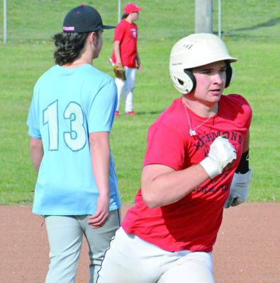 SPORTING A white batting helmet, Richmond first-year high schooler Jacob Lieberknecht rounds third base during a March 12 practice at Southview Park. SHAWN RONEY | Staff