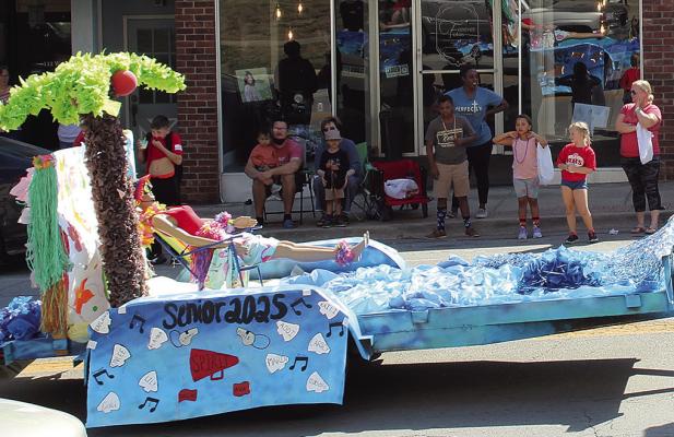 THE SENIOR CLASS beach-themed floats rolls through the streets during the homecoming parade. SHARON DONAT | Staff