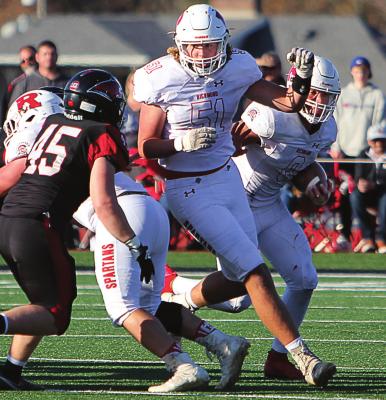 WITH JUNIOR LINEMAN Jack Gogue in front of him, Richmond senior quarterback Keyshaun Elliott seeks running room against the Lamar Tigers. J.C. VENTIMIGLIA | Staff