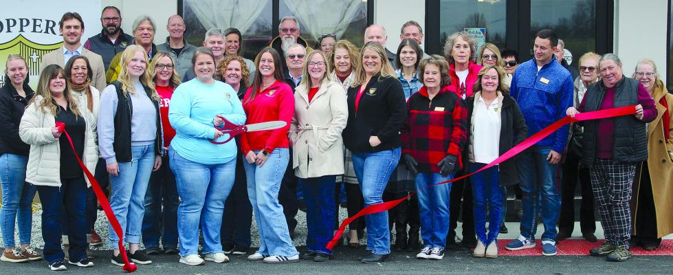 CHAMBER AND COMMUNITY members take part in a ribbon-cutting recognizing the opening of Goppert Bank in Richmond. SHARON DONAT | Staff