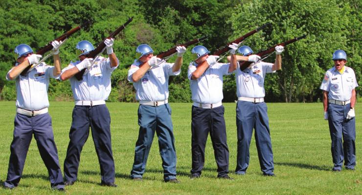 LEST WE FORGET IN MEMORY of veterans who have died, the Veterans Honor Team fires a salute. From left are Jim Richardson, Homer Lollard, Jack Orr, Royce Brock, Bill Cain and, giving the command, Jim Bowman. J.C. VENTIMIGLIA | Staff