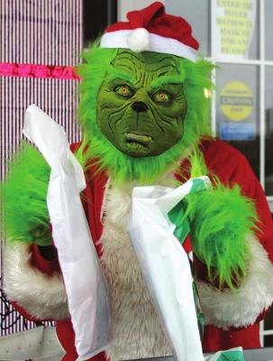 THE GRINCH is aided by Sharon Donat from The Richmond News and Excelsior Springs Standard.