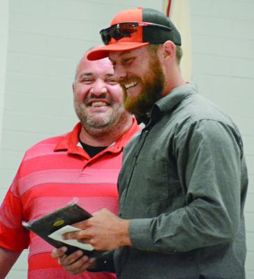 BRANDON QUICK (left) and Cody Gorham share a moment of joy during the Richmond Spartan Athletic Hall of Fame induction ceremony. SHAWN RONEY | Staff