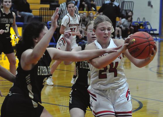 SOPHOMORE Laney Moyer snags a fourth-quarter rebound as the Spartans take Excelsior Springs to the wire Dec. 10 at the Husker Classic. SHAWN RONEY | Staff