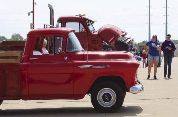 COMMUNITY MEMBERS gather during the Spartan Spectacular Auto Show to raise money and view vintage vehicles. SHARON DONAT | Staff