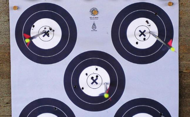 IN THE WHITE: During the archery competition, Dantin McBee, 11, keeps each flight tight in the white. 