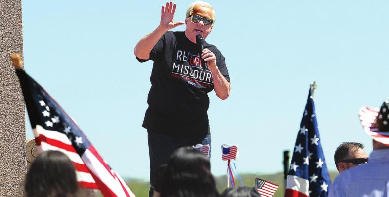 RADIO SHOW HOST Dave “Super Dave” Day warms up the Reopen Missouri crowd of about 500 on the Capitol grounds in Jefferson City last week. Several crowd members carry signs that denounce Gov. Mike Parson for issuing a stay-home order. Parson orders most of Missouri to reopen Monday. J.C. VENTIMIGLIA | Staff