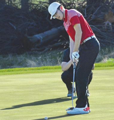 SENIOR AIDEN BOWMAN attempts a putt during Richmond’s boys golf dual with Lawson on Monday at Shirkey Golf Course. SHAWN RONEY | Staff