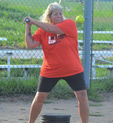 HARDIN-CENTRAL varsity softball coach Brandee Doyle drills her Bulldogs on their fielding by hitting them some grounders Monday morning at the Hardin American Legion and Auxiliary baseball and softball fields. SHAWN RONEY | Staff