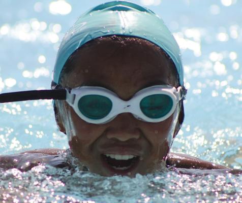 ERIANNA ELEGINO pushes through a breaststroke heat during a summer swim meet. SHARON DONAT | Staff
