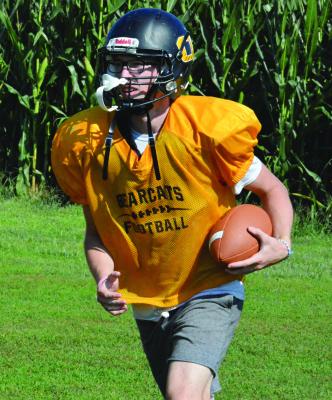 SENIOR JONATHON HARRIS, a Class 1 state-qualifying hurdler in boys track, is looking to use his running ability this fall in 8-man football as he controls Orrick’s rushing-oriented offense at quarterback. SHAWN RONEY | Staff