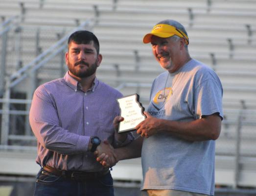 HARDIN-CENTRAL grad Dan Carpenter, left, receives his Missouri 8-Man Football Hall of Fame commemorative plaque from coach Kirk Thacker. SHAWN RONEY | Staff