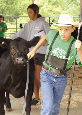 CORBIN BROCKHAUS won first place in the junior showmanship class.