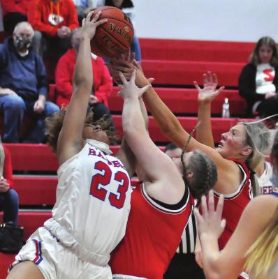 RICHMOND’S Lexi Bokarae, center, and Emmalea Kilpatrick fight with Pembroke Hill’s Jordyn Smith for a first-half rebound while Pembroke Hill junior Ava Rasmus watches Monday night in Richmond Winter Classic action. SHAWN RONEY | Staff