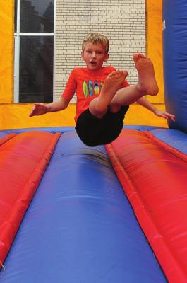 AMONG THE ACTIVITIES for Hardin's 150th anniversayr celebration is a bounce house, which gets a workout from Jensen Finley, 8.