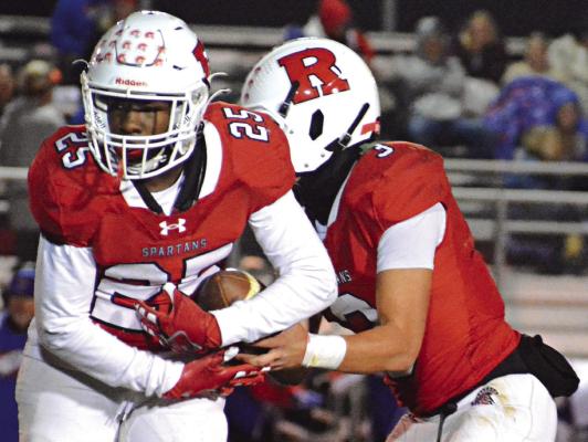 SAVION WEBB (left) and Jayden Pearson get reps on offense during Richmond’s Bell Game rout of archrival Lexington. SHAWN RONEY | Staff