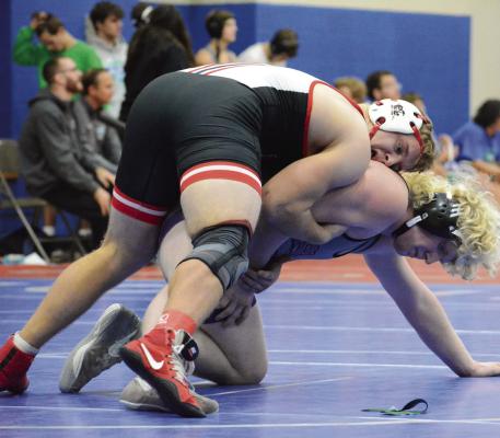 WRESTLING IN the upper position, Richmond senior Aidan Ivison works to break down South Harrison’s Mayson Edwards in Tom Hayes Dual Tournament action Dec. 10 at Lexington Middle School. SHAWN RONEY | Staff