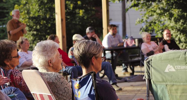 COMMUNITY MEMBERS listen to area musicians perform as part of the 816 Music Celebration, sponsored by the Richmond Area Chamber of Commerce and local churches.