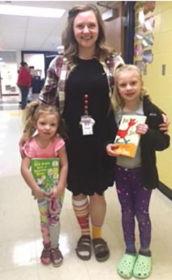 FIRST-GRADE teacher Shelbie Jones and daughters Olivia and Annabelle show off wacky socks.