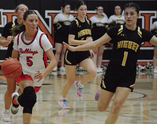 HARDIN-CENTRAL SENIOR Ester Kincaid (left) pushes the tempo during the varsity girls basketball game on courtwarming night. The Hardin-Central girls dropped the Feb. 4 meeting with Higbee 77-49. SHAWN RONEY | Staff