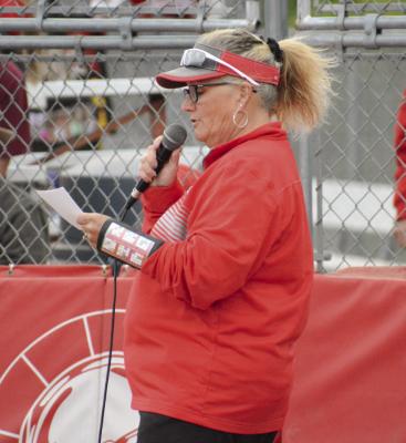 RICHMOND COACH Staci Maddux honors her seniors Sept. 22 at Southview Park.