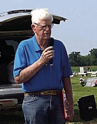 STEPHEN SHIRLEY LEADS the Memorial Day service at Hardin Cemetery.