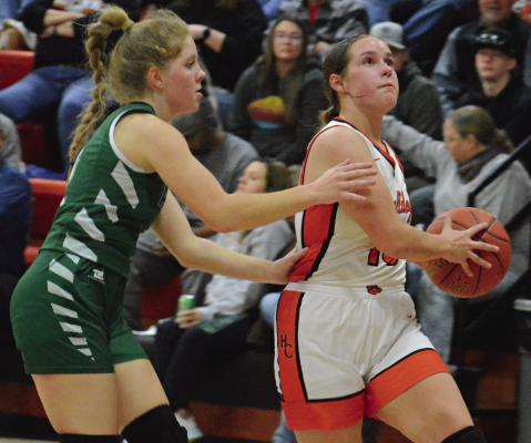 SENIOR ADDISON SCHACHTELE (right) eyes the basket as she drives toward the hoop for Hardin-Central against Tina-Avalon. SHAWN RONEY | Staff