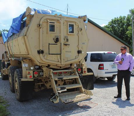 THIS ARMORED personnel carrier, called an MRAP, is described by sheriff’s detective Mark Crawford as being able to transport several law enforcers up close to a building where armed criminals might be holding hostages or into disaster areas. Secured from the U.S. Department of Defense at no cost to county taxpayers by Sgt. Brock Billings, the MRAP is on loan to the Ray County Sheriff’s Office. J.C. VENTIMIGLIA | Staff