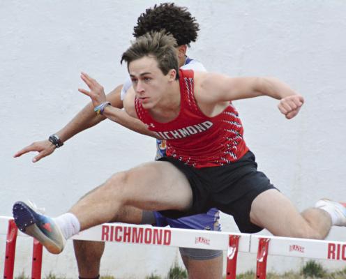 ON A QUEST to qualify for state competition again, senior Dayne Loftin zips through the boys 110-meter high hurdles March 23 during Richmond’s season- and home-opening track meet. SHAWN RONEY | Staff