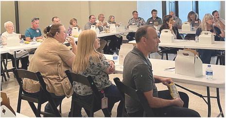 BUSINESS LEADERS gather July 27 at the chamber luncheon to hear analyses of the county from three state Department of Economic Development representatives and the opportunities available for growth. BRIAN RICE | Staff