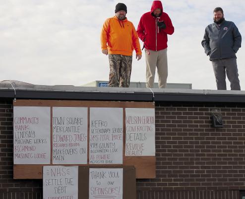 RICHMOND HIGH SCHOOL Principal Brandon Quick (from left), RHS Assistant Principal Matt Habermehl and RHS Athletic Director Josh McCray spent the night on the roof as part of SOPHIA BALES | Staff the Raise the Roof fundraiser.