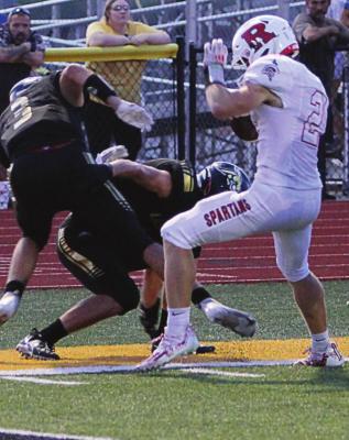 SENIOR Evan Vandiver’s sideline work gets the Spartans 20 yards and inside Lathrop’s 5-yard line.