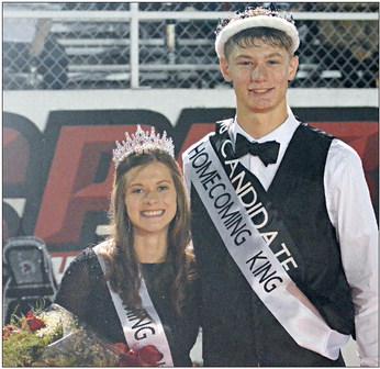 BASKING IN the glow of the backlighting from the press box and stadium lights, Grace Bozarth (left) and Gabe Baker beam after being crowned as Richmond’s homecoming royalty Sept. 22 at Spartan Stadium. SHAWN RONEY | Staff