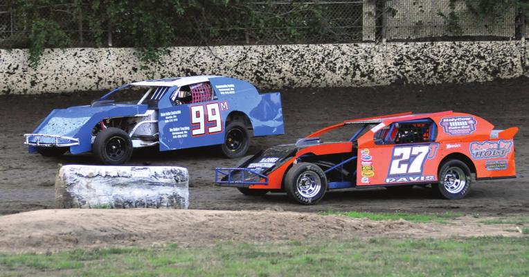 DRIVING THE 99M car, Richmond’s Skyler Nolker looks to get by Jeff Davis July 25 at Central Missouri Speedway. SHAWN RONEY | Staff