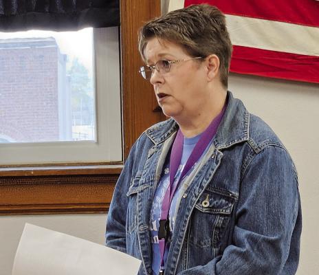 PUBLIC ADMINISTRATOR Shannon Morris addresses commissioners with questions about a planned bathroom renovation and its potential impact on office operations and employee safety.