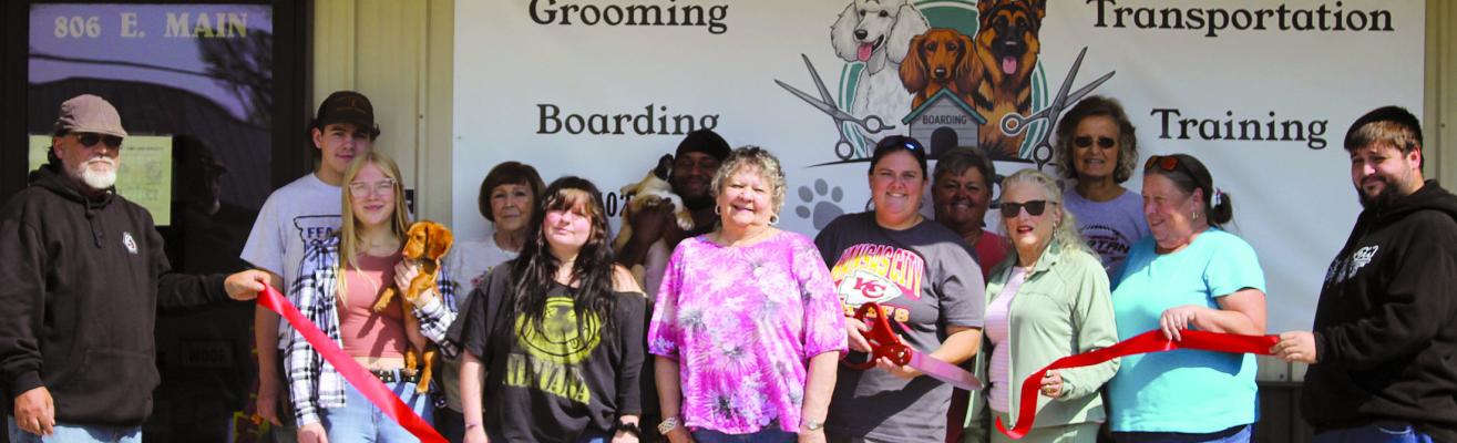 SHARON DONAT | Staff COMMUNITY MEMBERS join VIP Pet Care &amp; Services for a ribboncutting at its new location, 806 East Main Street.