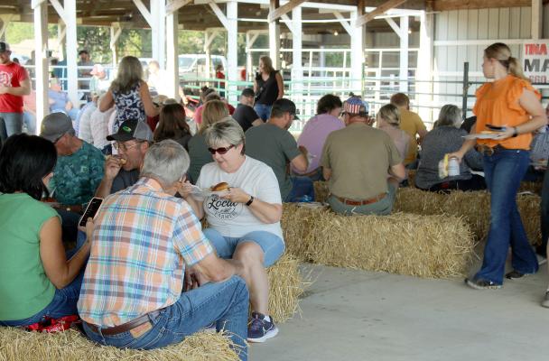 BRENDA HAMM (center) enjoys the Farmers Appreciation Dinner with other attendees. SHARON DONAT | Staff