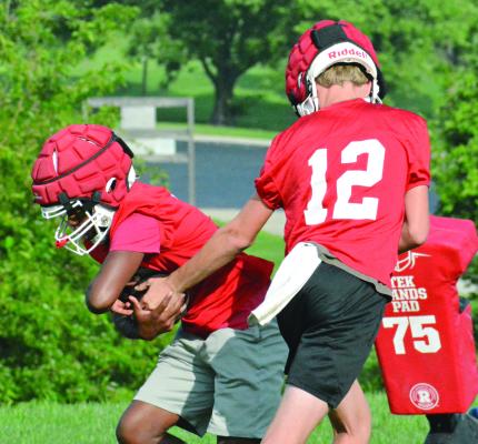 JUNIORS CHRIS WEBB (left) and Jacob Johnson are among the skill position players who are taking on starting roles this season for Richmond in varsity 11-man football. SHAWN RONEY | Staff