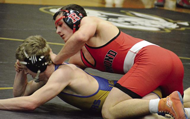 WRESTLING IN the top position, Richmond senior Elijah Sanders maintains control of Lafayette County’s Braxton Ernst during their 165-pound championship title match Feb. 3 at the Lathrop Invitational. SHAWN RONEY | Staff