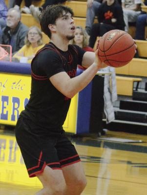 RICHMOND SOPHOMORE Dryden Hendrix shoots a slew of free throws resulting from multiple technical fouls called against Lafayette County of Higginsville late in the Husker Classic title tilt. SHAWN RONEY | Staff