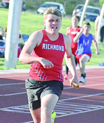 SENIOR ELI STEELE finishes off the varsity boys 400-meter relay Monday at the Missouri River Valley Conference East Division meet at Carrollton. SHAWN RONEY | Staff