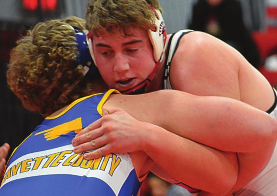 ZANE RENFRO, Richmond senior and 2022 mat king, grapples during the Spartans’ Jan. 27 triangular with Lafayette County of Higginsville and Polo. SHAWN RONEY | Staff