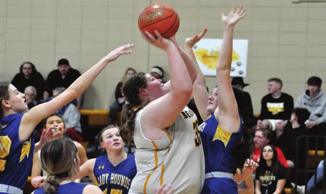 SHAWN RONEY | Richmond News ORRICK JUNIOR Emma Wilson takes a contested shot in the post during the Bearcats’ 40-37 win Tuesday night over visiting Sweet Springs/Malta Bend.
