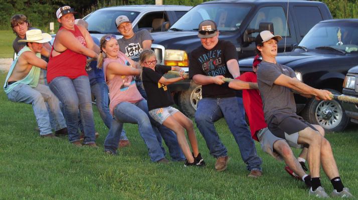 SHARON DONAT | Staff ORRICK AND HARDIN FFA Chapters struggle against the Richmond FFA chapter in a tug -o-war.