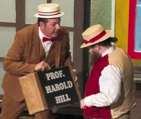 RYAN KUGLER (left), staring as Professor Harold Hill, is joined onstage by Scott Arnett. JOSHUA BRUNGARDT | Staff